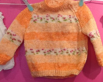 Hand knitted baby girl jumper