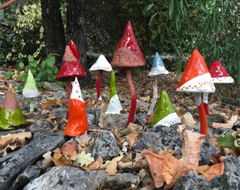 Red and white ceramic mushrooms glazed