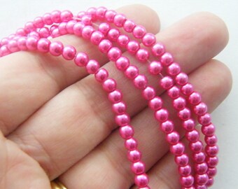 200 Fuchsia imitation glass beads B150