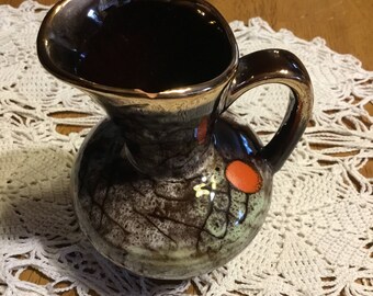 Vintage Ceramic Pitcher that says Made In Germany and it is numbered 432 . . .