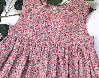 Liberty London Floral Cotton Lawn Girls Dress. Red and neutral colours. Smock dress 0-10 years.