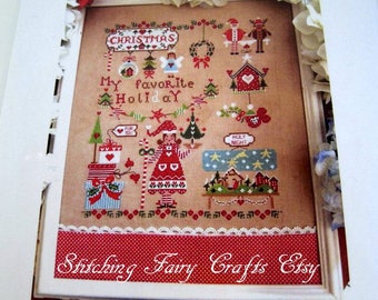 Christmas cross stitch pattern by Cuore e Batticuore, includes inscription for English, French Italian and German.