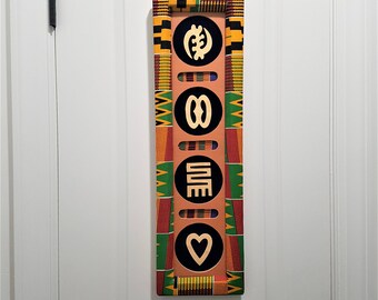 Kente wall decor with African symbols