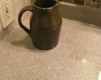 Handmade stoneware pitcher in olive green