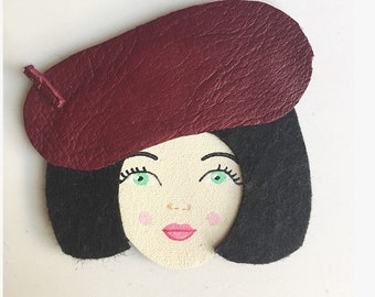 Face with raspberry leather Hat pin