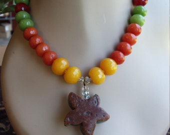 One strand beaded necklace with center drop