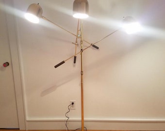Gold Mid Century Modern three armed articulating floor lamp