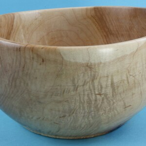Interesting shape and curly grain green turned maple bowl