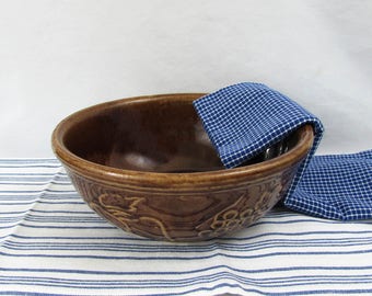 Embossed fruit pattern 9" brown stoneware mixing bowl, vintage USA pottery
