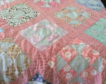 Charming Vintage 1930's quilt top. Sashing is red with white dots. Still very colorful. Beautifully sewn. No stains, no tearsor fraying.