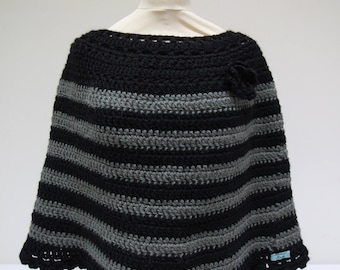 Black poncho with wide stripes and flower
