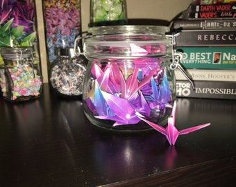 Origami cranes in glass jar with clasp