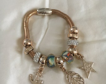 Dangling magnetic fashion braceletwith beads and trinkets