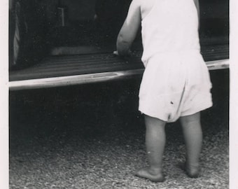 vintage photo 1940 Little Curl Hair Toddler Boy Plays on Car Runner From Back