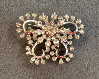 Vintage Clear Rhinestone Brooch with Riveted Construction . Free shipping