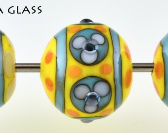 Three pretty floral lamp work glass beads