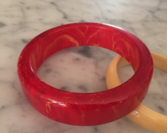 Vintage red bakelite bangle with orange marbling