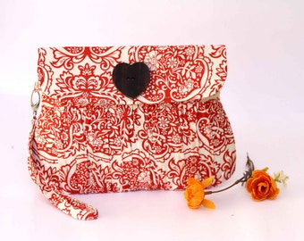 Orange clutch pleated purse, orange and white floral purse
