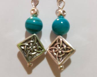 Silver drop earring with teal glass bead and Celtic knot