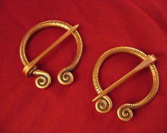 Pair of Spiral Penannular Brooches