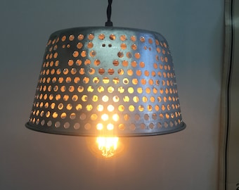Vintage Industrial metal basket repurposed into a hanging lamp