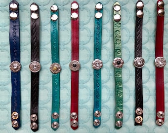 Leather bracelets with crystal and stone accents.