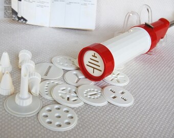 Red and White Cookie Press with Instructions and Leifheit Recipe Booklet Biscuit Press marked U.K. Regd. design No. 1036404