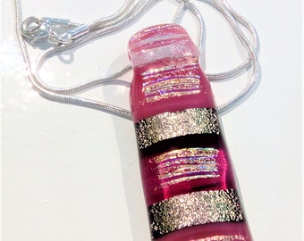 Handmade pink and dichroic glass pendant.