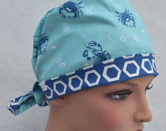 Tie Back Scrub Cap scrub hat featuring a blue material with a nautical theme with crabs and a coordinating band 2t