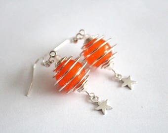 SATELLITE earrings and orange beads