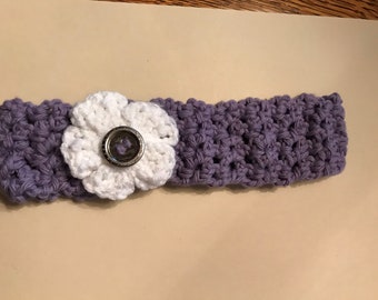 Handmade crocheted headband with flower and button
