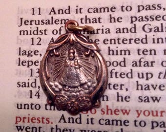 The Infant Jesus of Prague- Vintage Religious Jewelry in silver with the Sacred Heart of Jesus on one side
