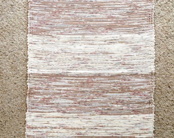 beige, white and rose rag rug
