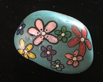 Hand painted rock with flowers
