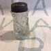 Glass salt shaker with metal lid