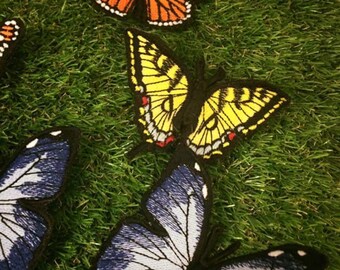 Embroidered butterfly brooch.