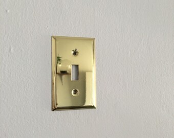 glam brass hollywood regency light switch cover. mid century brass regency switchplate. lighting boho interior design wall decor
