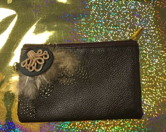 Small brown wristlet