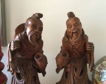Two hand carved wooden figurines, Asian