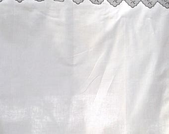 curtain with scalloped embroidery and pleats