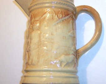 Vintage Pitcher, Yellow with Sculpted figures, 10" high, 6" dia. at base