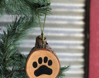 Paw print wood slice ornament or key chain.