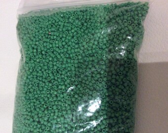 Less than 2 mm Green seed beads. Just about