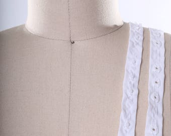 Clear Plastic Snap Tape Trim set on 0.75" White Trim. Perfect for Baby Clothing and Corsets