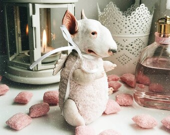 Little cute pink baby bullterier doll with wings