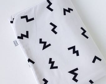 White baby blanket with black print