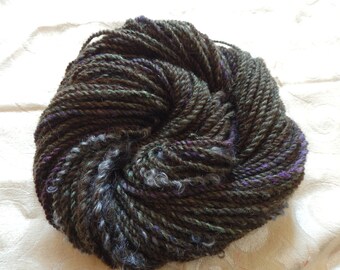 Maleficent handspun art yarn with green and purple sparkles and gray locks, 73 yards of Aran weight yarn