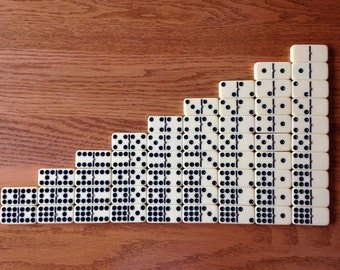 Lot of 54 Cream-colored Dominoes with brass spinners for crafts