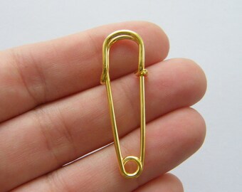 10 Safety pin brooches gold tone