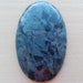 Rhodusite oval form cabochon